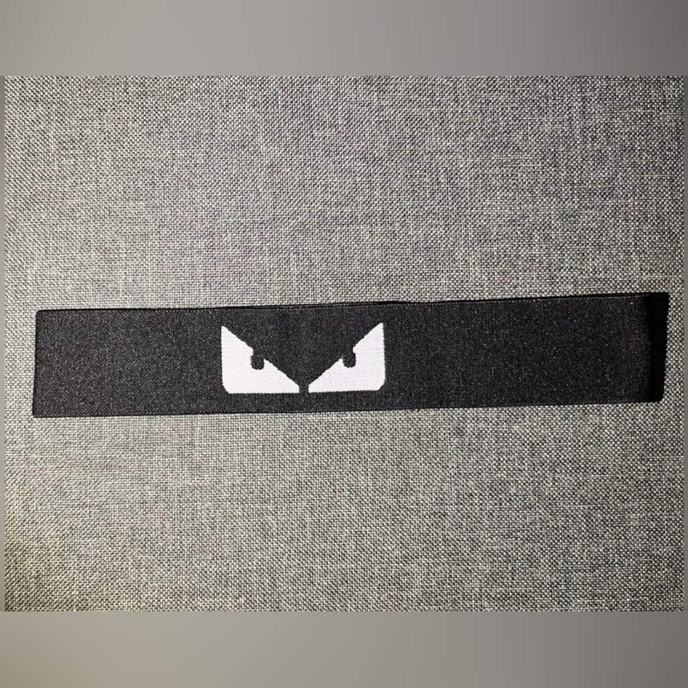 Saks Fifth Avenue Black and White Eyewear or Hairband with Eye Motif